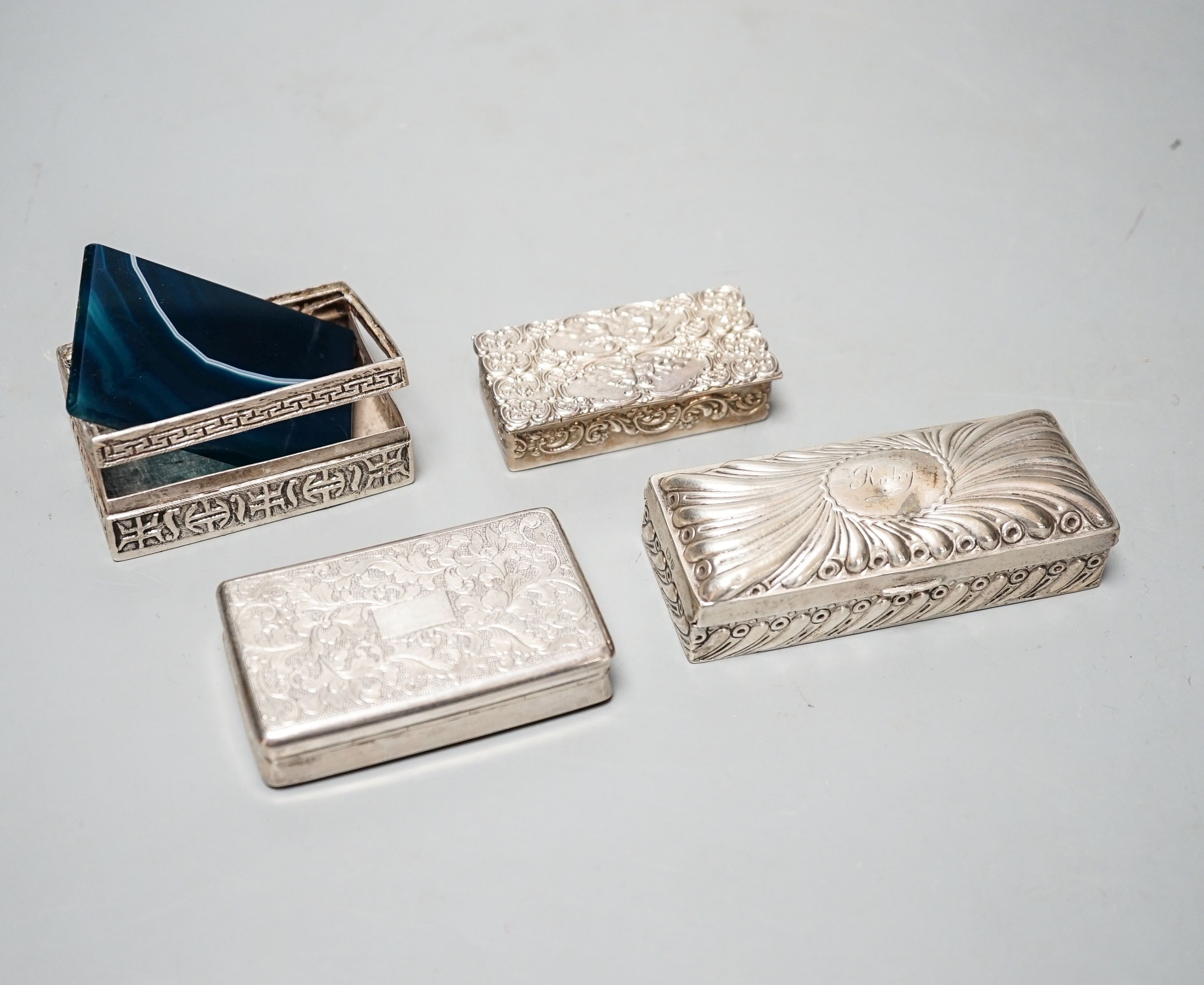 A late Victorian silver ring box, London, 1895(a.f.), 97mm, a later silver snuff box and two white metakl boxes.